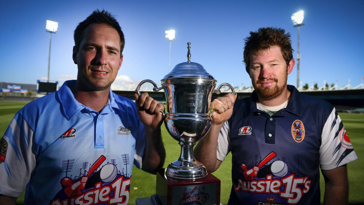 Mathew Scolyer, of Star Bar Slashers, and Dane Anderson,  of Cock 'N` Bull Crusaders,  with the Aussie 15s' grand final cup  that they will be playing for at Aurora Stadium tonight.  Picture: PHILLIP BIGGS