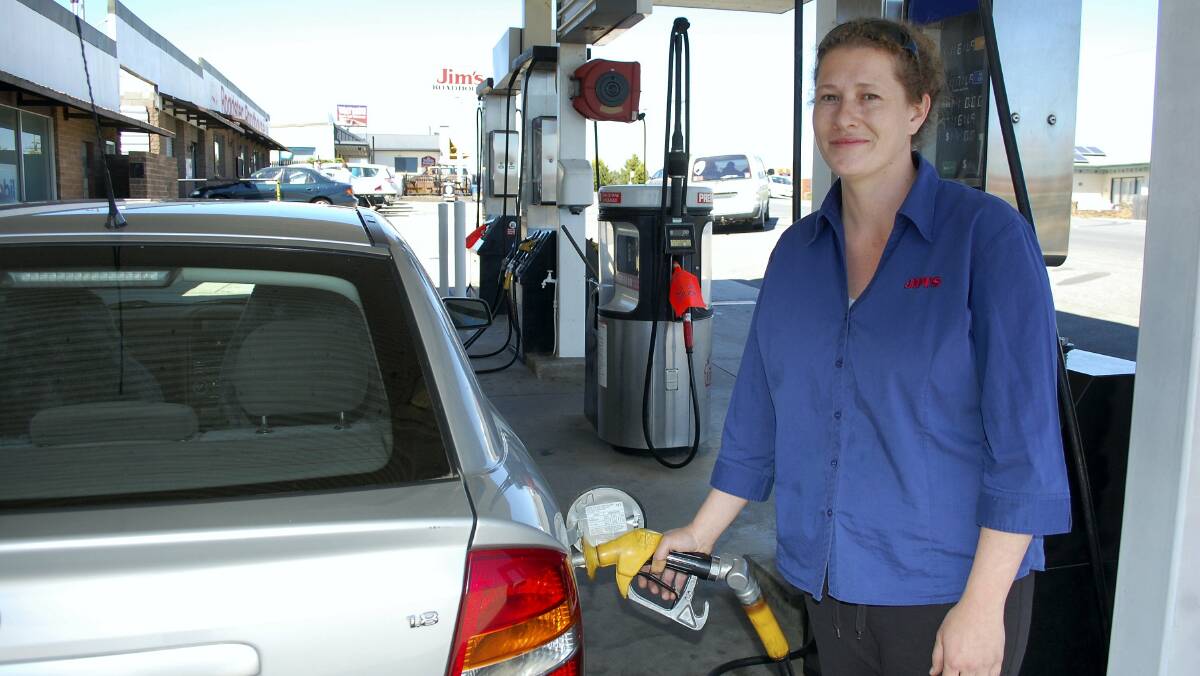 Jims Car Care Centre staff member Janelle Hanham pumps petrol at the Prospect station.