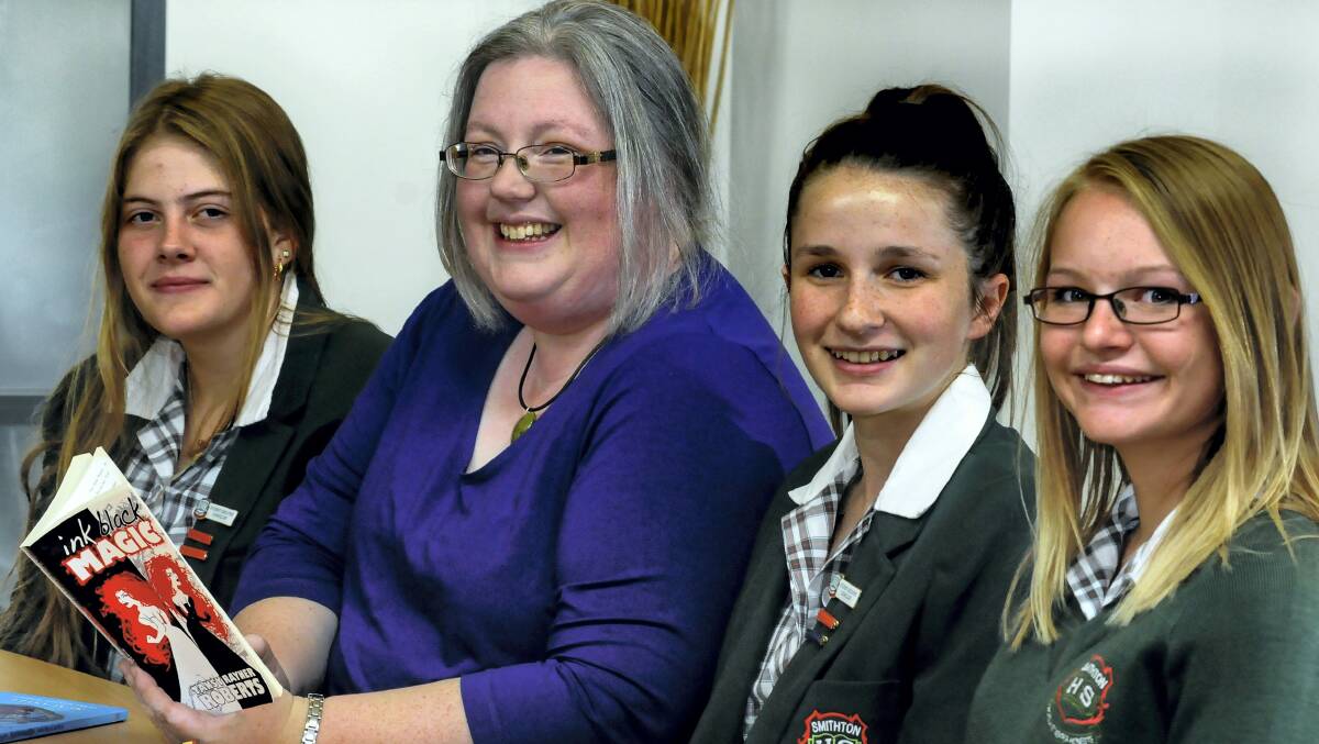 Author Tansey Rayner Roberts gives a talk about her books to Smithton High School students (from left) Tamara Hursen, Tansey Rayner Roberts, Brielle Kay and Siobhan McDonald. Picture: NEIL RICHARDSON