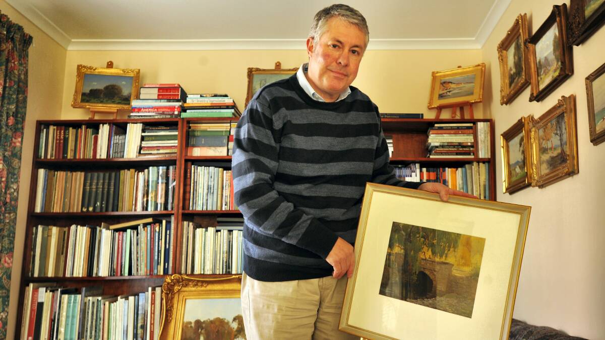 Prospect art dealer Martin McBain with a work by artist John Eldershaw that will be offered for sale at this year's Tasmanian Antiques Fair.  Picture: SCOTT GELSTON
