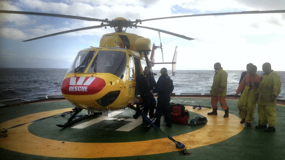 The police search and rescue helicopter is prepared for a mission to airlift a seriously ill French sailor  from the ice-breaking research vessel L'Astrolabe.