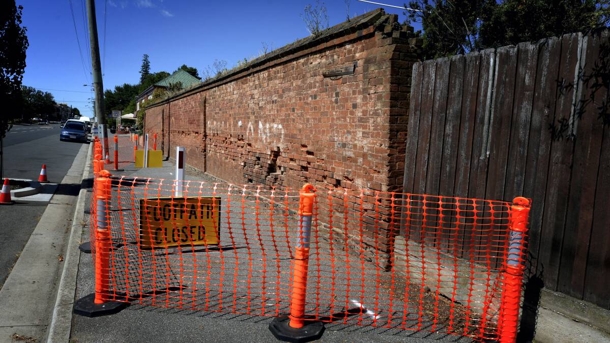 The Northern Midlands Council has closed a section of the footpath in Longford's Wellington Street due to the fragile health of the wall near the heritage-listed JJ's Bakery.  Picture: GEOFF ROBSON