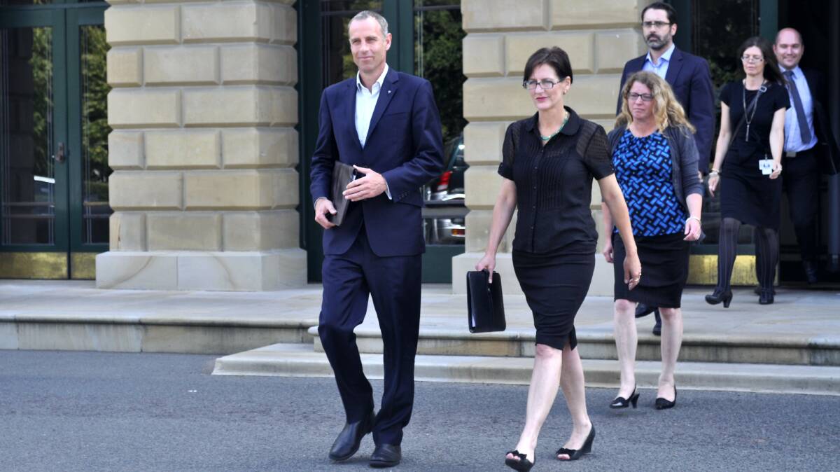 Sacked Greens ministers Nick McKim and Cassy O'Connor leave Parliament House followed by their staff. Picture: GEORGIE BURGESS