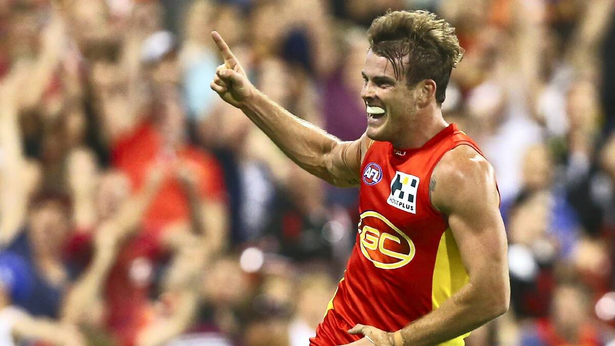 Burnie's Luke Russell celebrates a goal for the Gold Coast Suns against St Kilda on Saturday night.   Picture: GETTY IMAGES