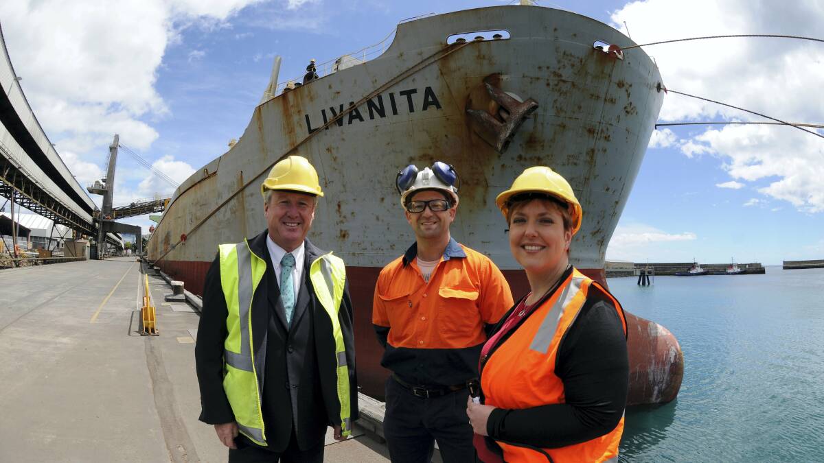 Deputy Premier Bryan Green, Shree Minerals mine geologist David Gibbons and Premier Lara Giddings beside the ship Livanita bound for China with the first shipment of iron ore from the Shree mine, south of Smithton. Picture: PAUL SCAMBLER