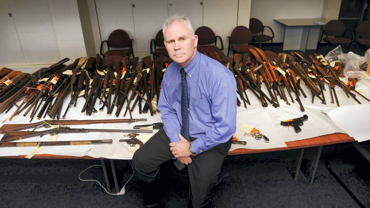 Launceston CIB Detective Inspector Scott Flude with some of the guns that  have been handed in. Picture: SCOTT GELSTON