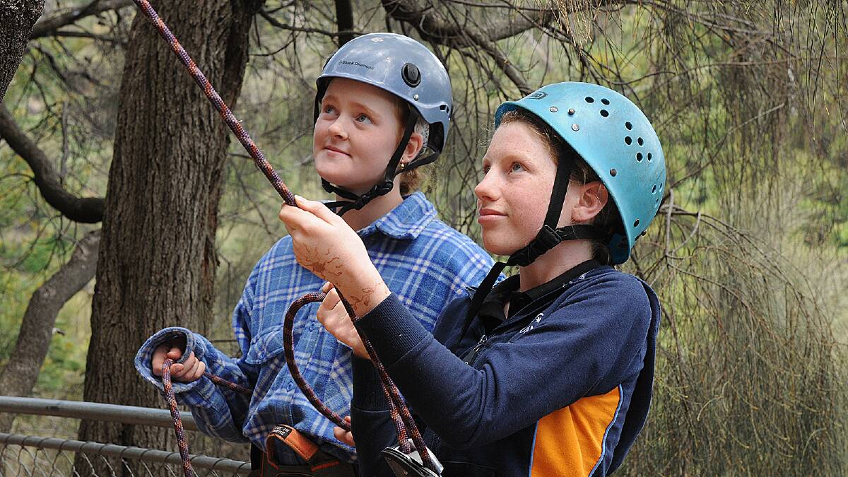 Girl Guides try rock climbing and water skiing