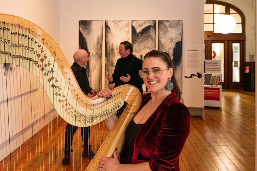 LIVE ART: Harpist Emily Sanzaro with artist Tony Smibert, and deputy mayor Danny Gibson. Picture: Phillip Biggs