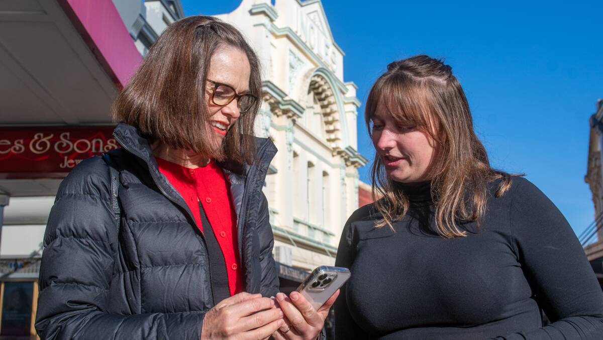 WALK ON: Launceston Historic Society's Catherine Pearce and Launceston Central City's Madi Biggelaar check out the walking tour. Picture: Paul Scambler