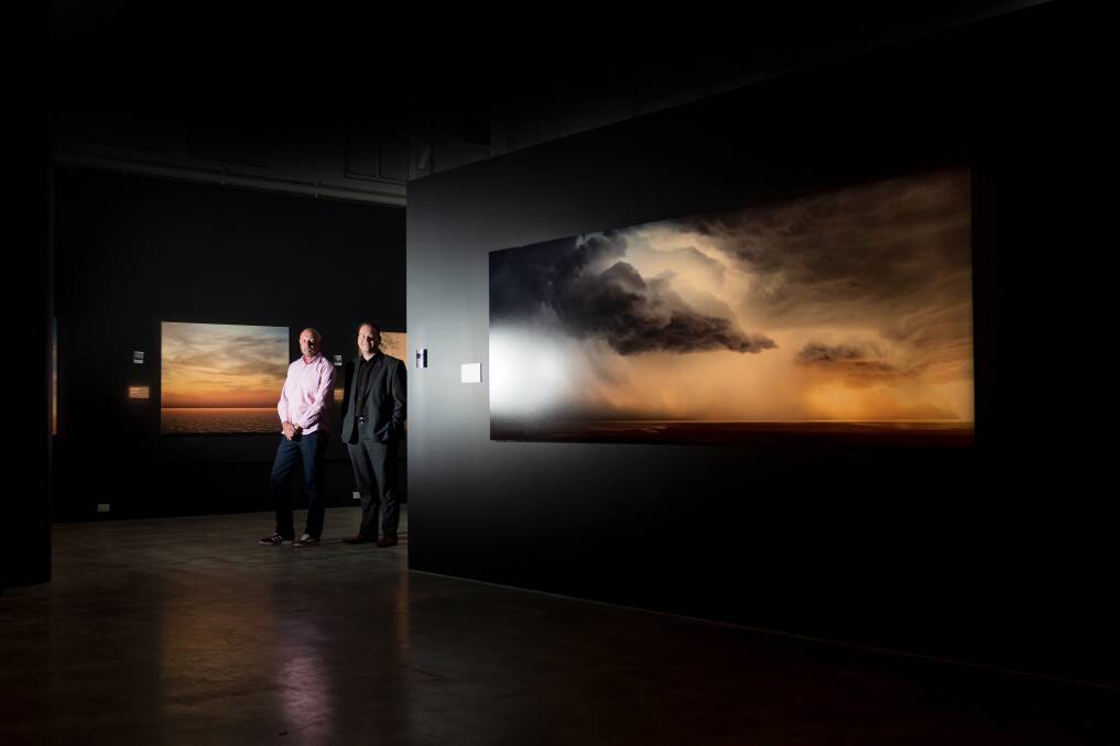 QVMAG general manager Shane Fitzgerald and Launceston mayor Danny Gibson at the launch of Murray Fredericks' exhibition at QVMAG Inveresk, where his large-scale images will be on display for three months. Picture by Phillip Biggs
