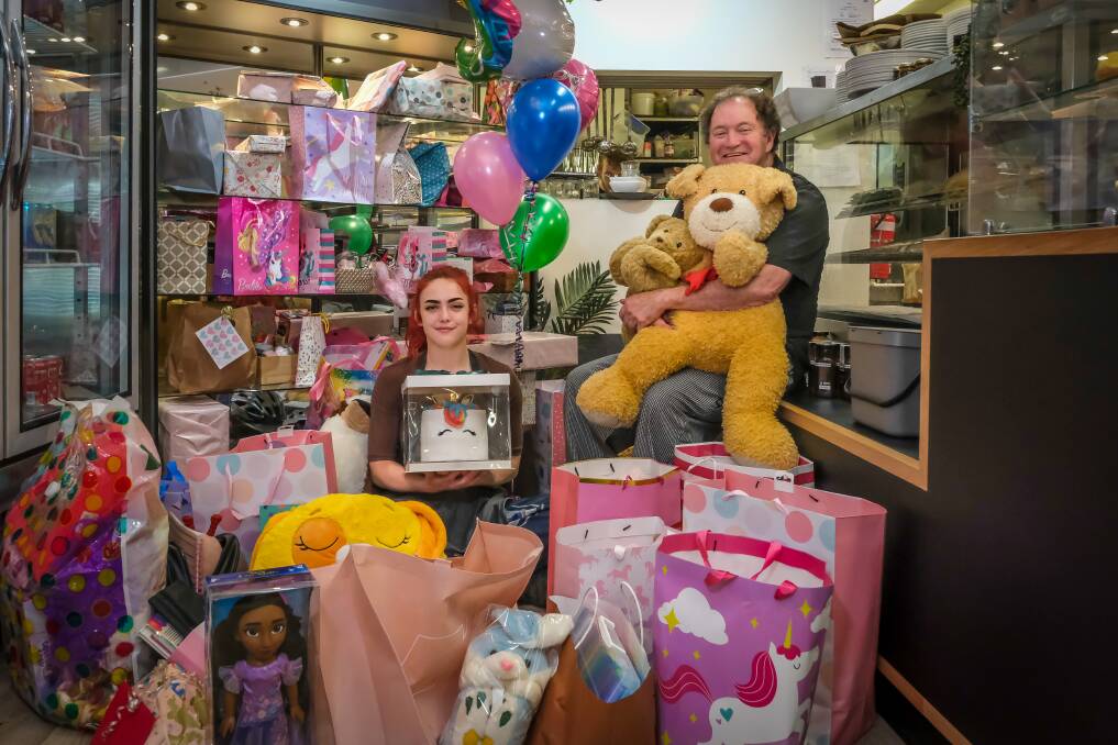 Charlie and Paul Giddins with the presents donated to help a young girl celebrate her sixth birthday. Picture by Craig George