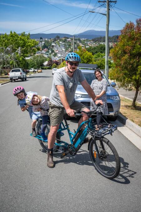 Kate and Jake Richards with their daughters Jilly, 5, and Indy, 3 on the cargo e-bike. Picture by Paul Scambler