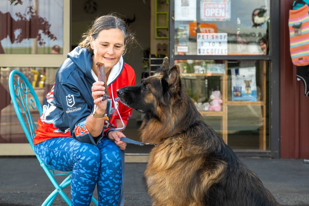 Melinda Cox, of Exeter, with Brian outside Karen Kendall's new pet store in Exeter called Animal Tales Tasmania, with a focus on Australian natural products. Picture by Phillip Biggs