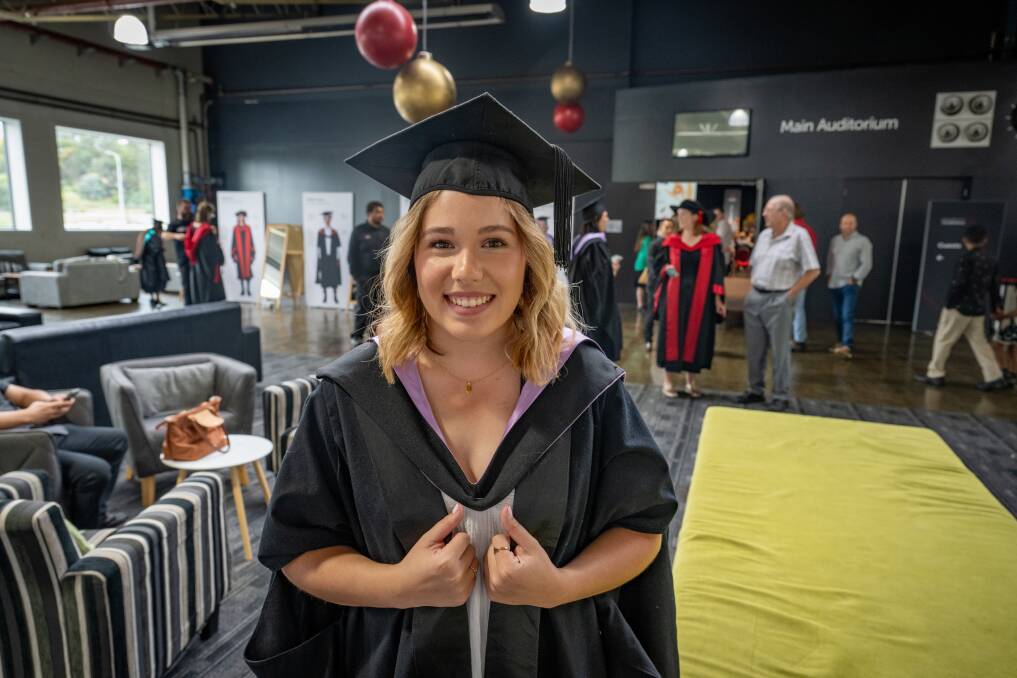 Abbey Savage celebrates graduating from her Master of Psychology at Launceston Conference Centre. Picture by Paul Scambler