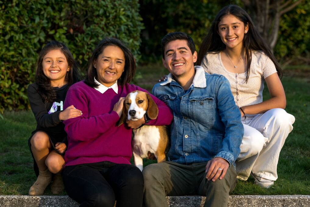 Cesar Penuela and his wife Claudia Castillo, of Trevallyn, and daughters Janah and Maria, and Nino the dog. Picture by Phillip Biggs