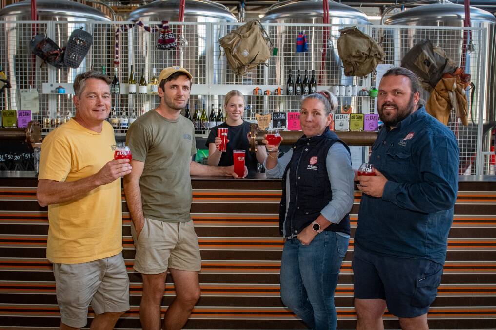 Du Cane Brewery co-owners Sam Reid and Will Horan with Leanne McKinnon and Brent Norton of Hillwood Berries, while Poppy Eastaugh serves up the new Raspberry Sour beer. Picture by Paul Scambler 