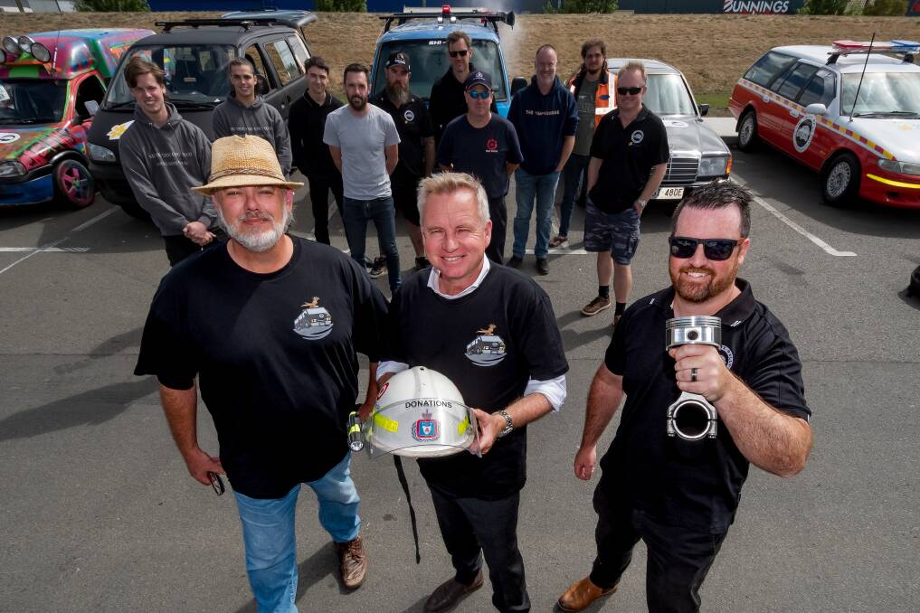 Drivers and their cars from the Shitbox Rally with Premier Jeremy Rockliff, who is flanked by Brett Carlton and Alex Ives. The rally will go from Rockhampton to Hobart and is a major fundraiser for Cancer Council Australia. Picture by Phillip Biggs