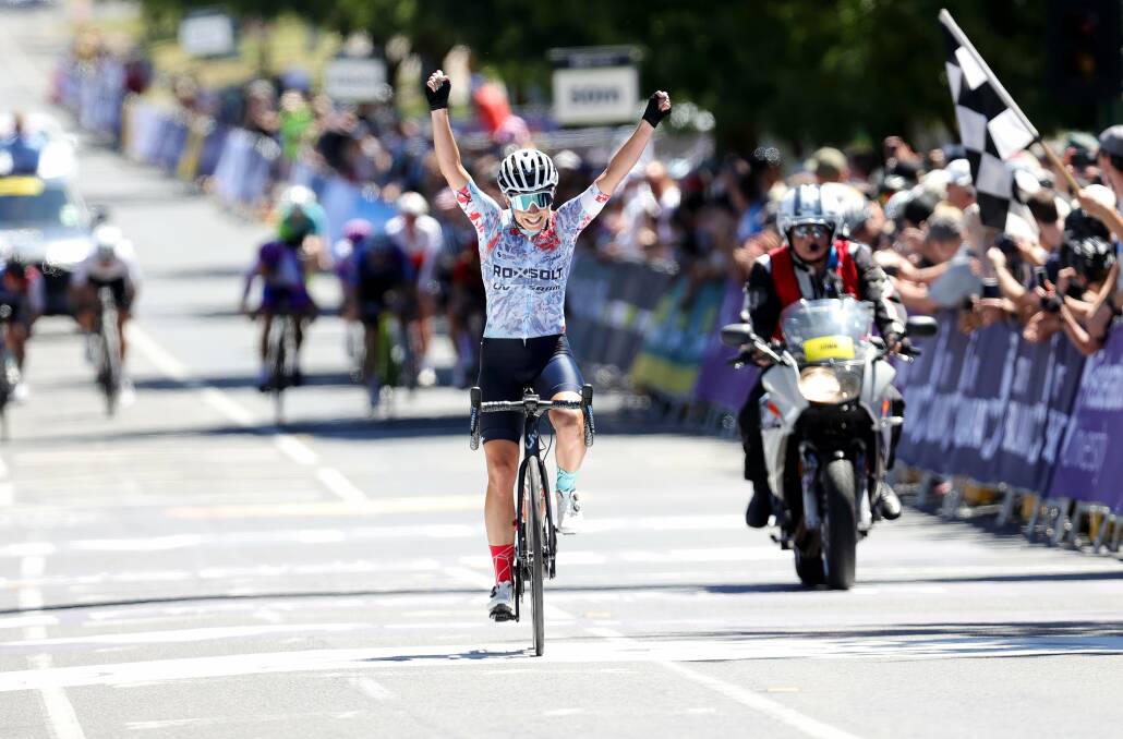 ROAD CHAMPION: Launceston's Nicole Frain raises her arms after sealing victory in the 104.4km race. Picture: Con Chronis
