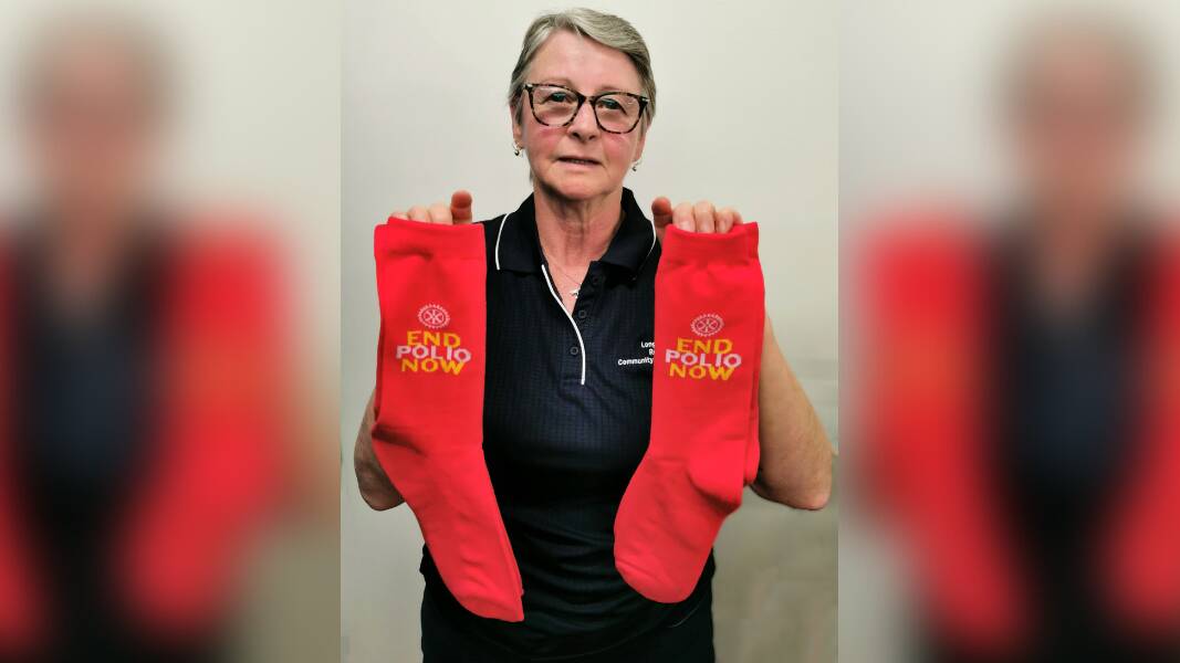 Longford Rotary Community Shop volunteer Lisa Green holding up the End Polio Now socks. Picture by Rod Oliver