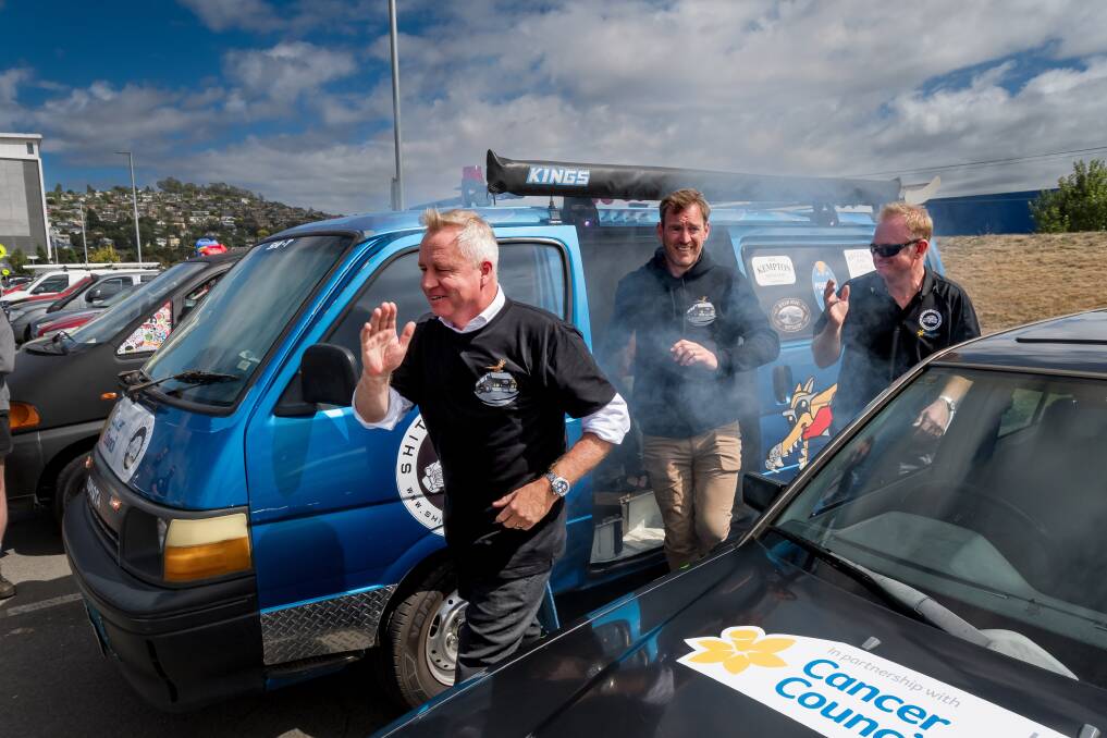 Premier Jeremy Rockliff runs away from a smoking engine. Picture by Phillip Biggs