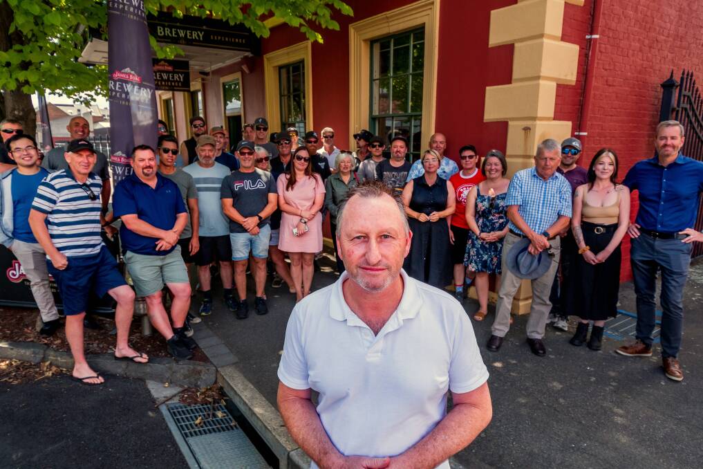 Boag's brewing technician and union delegate Adrian Hind shares a message alongside colleagues and community members of urging Lion to reverse the decision to close the visitor centre. Picture by Phillip Biggs