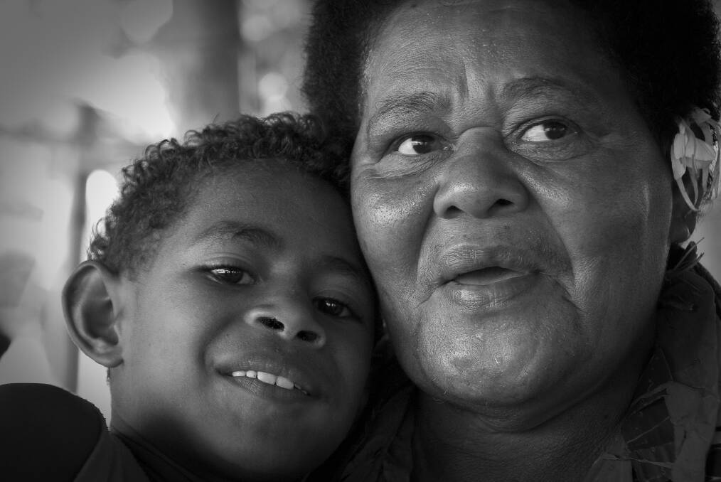 Fijian elder with her grandson.