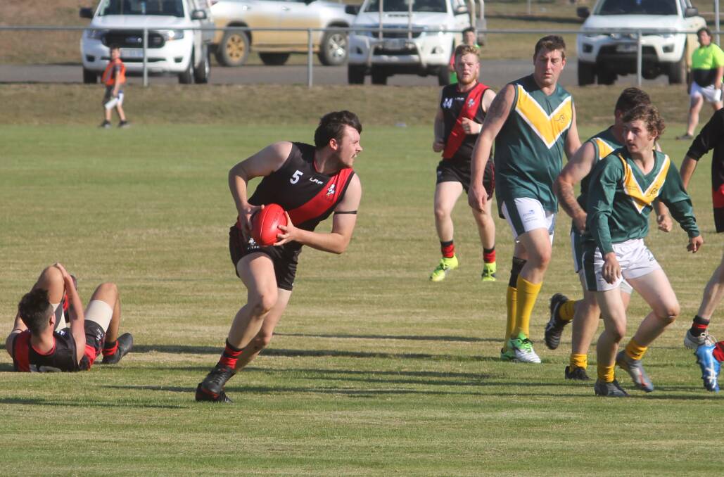 GAME ON: James Grey from Campbell Town about to dispose of the ball. Picture: Supplied