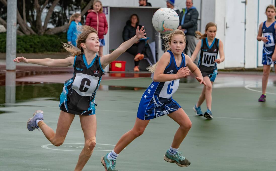 LOOK UP: Amazonz Cadoojte's Ellie Wooley (right) keeps her eye on Esk Stars' Sophia Vincour. Picture: Paul Scambler
