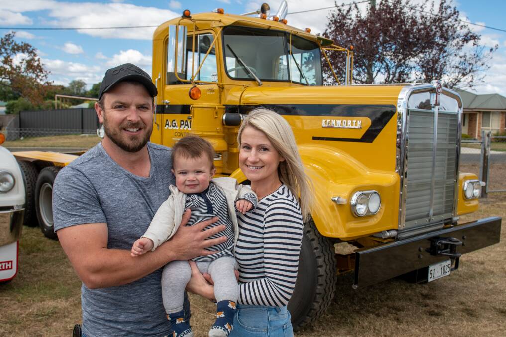 TRUCKS: Erin and Ken Padgett with son George, 1 enjoying the RFDS Tasmania truck run. George is the great grandson of AG Padgett. Picture: Paul Scambler