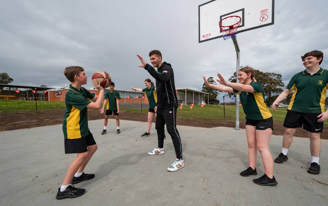 BASKETBALL BLITZ: Tasmania JackJumpers Will Magnay with Prospect High students Jacob Heger, Mihammad Karimi, Amber Brazendale, Hayley O'Callaghan, Kye Phillips. Picture: Phillip Biggs