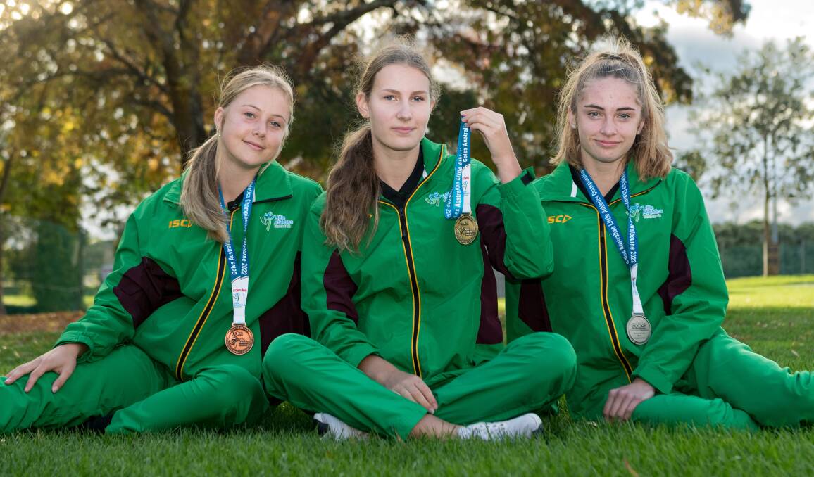 SHINING STARS: Charli Ross, Abbey Berlese and Izzy Wing did a clean sweep of the girls' under-15 podiums at the national Little Athletics championships. Picture: Phillip Biggs
