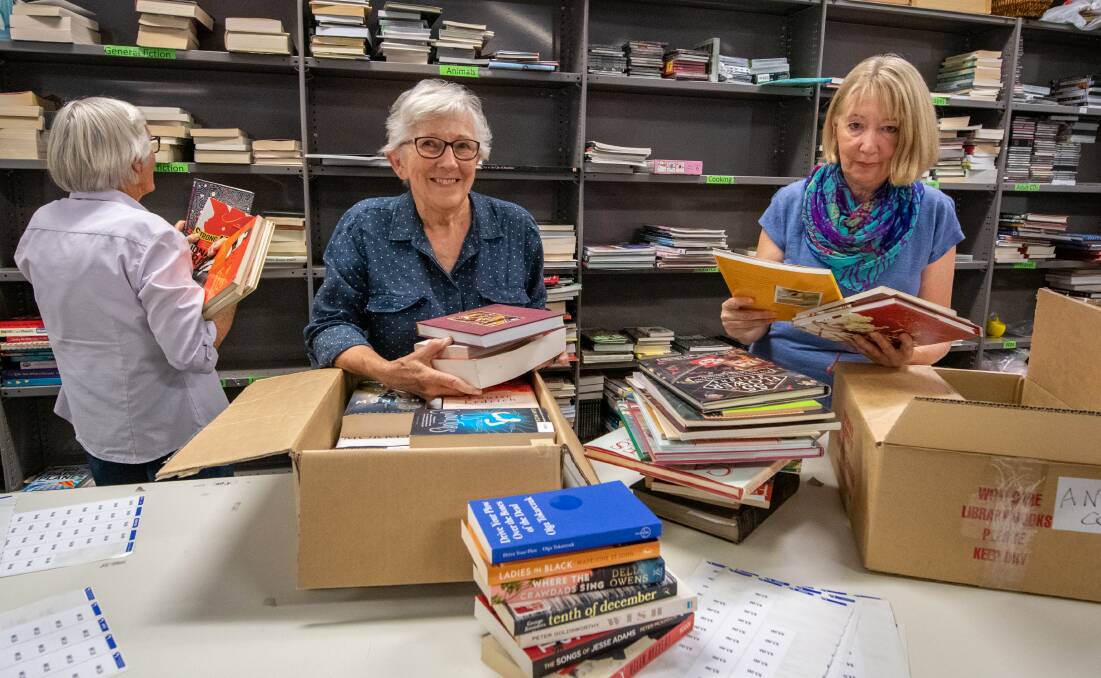 SALE: Secretary of Friends of Library Prue McCausland with volunteer Bev Buckland get ready for the annual book sale. Picture: Paul Scambler