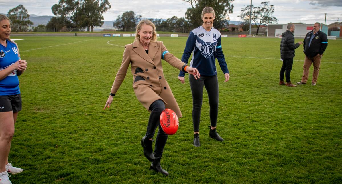 KICK IT LONG: NTFA patron Sarah Courtney with Old Launcestonians' Abbey Green at Youngtown Oval on Thursday. Picture: Paul Scambler 