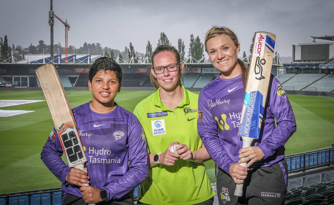 CRUNCH TIME: Hobart Hurricanes' Richa Ghosh and Mignon du Preez with the Sydney Thunder's Sam Bates ahead of their weekend fixtures which are played less than 24 hours apart. Picture: Craig George 