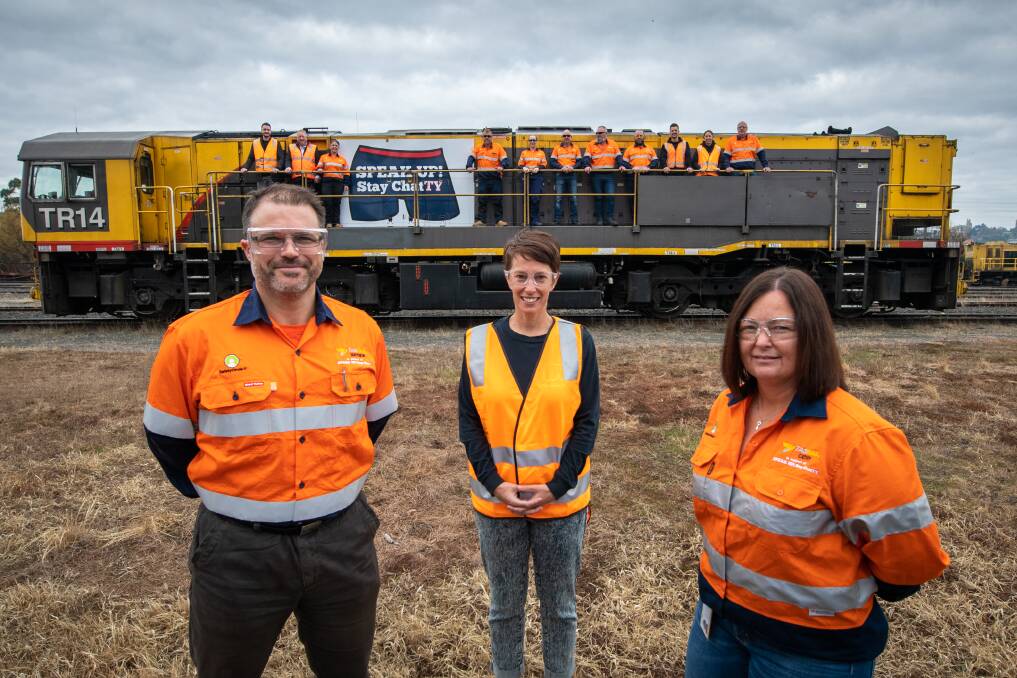 AWARENESS: TasRail workers Matthew Wheatley and Cathy Blyth with Speak Up! Stay ChatTY's Kylea Aldred in front of the Conversation Train. Picture: Paul Scambler