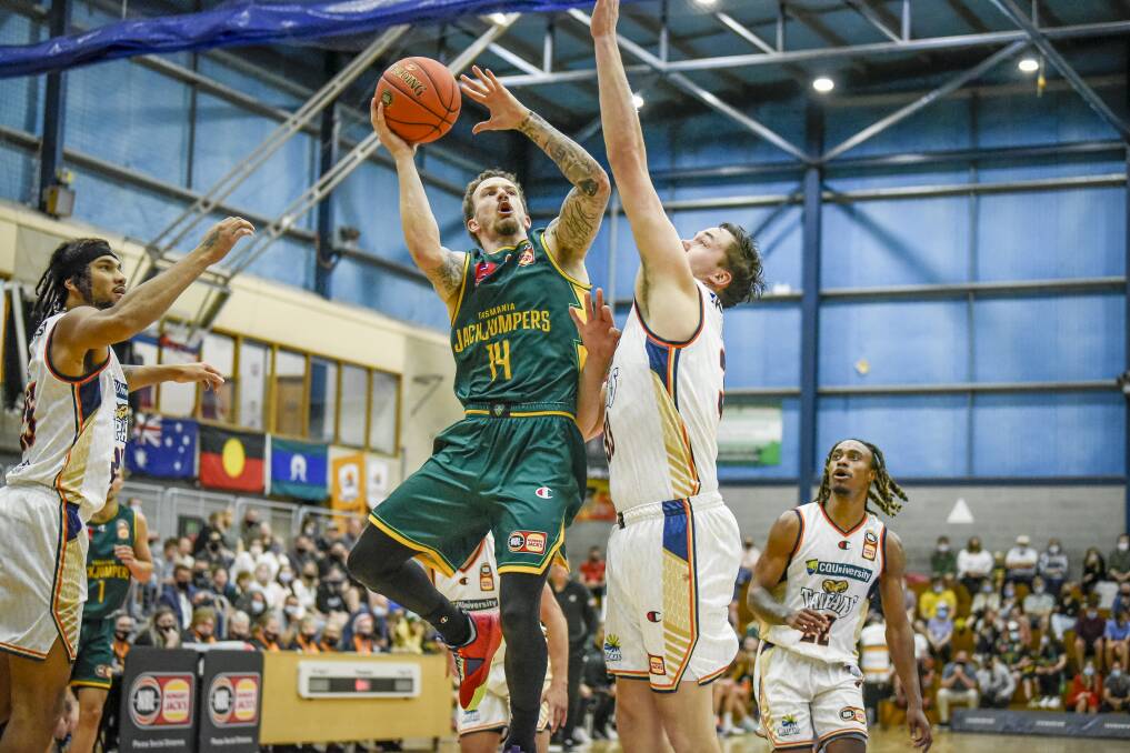 Josh Adams soars for a lay-up early on against the Cairns Taipans.