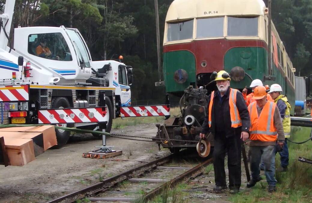 NEW ROLE: Paul Cabalzar (centre) is the new chairman of the Launceston and North Eastern Railway. Picture: Supplied