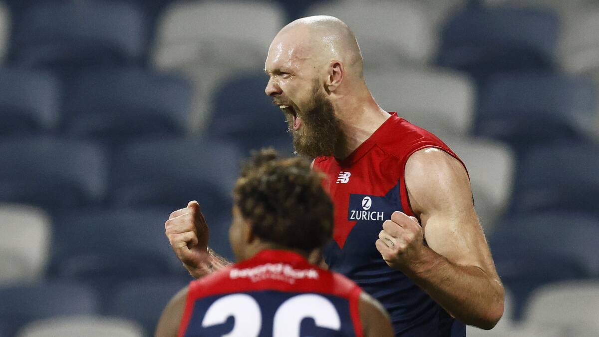  Max Gawn of the Demons celebrates after kicking a goal after the siren to seal Melbourne's minor premiership this season. 