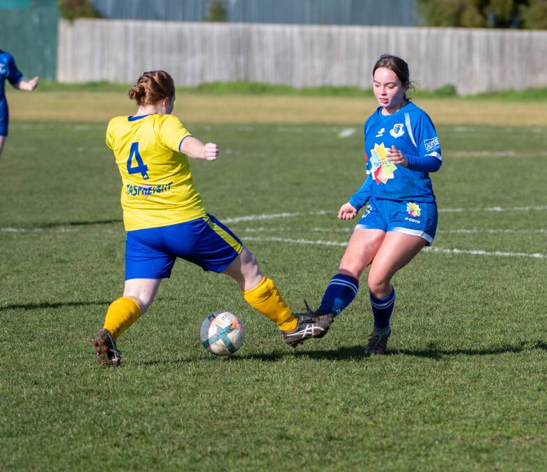 PASS AND MOVE: Launceston United's Evie Cheney delivers a pass against Devonport who won at Birch Avenue on Saturday. Pictures: Paul Scambler