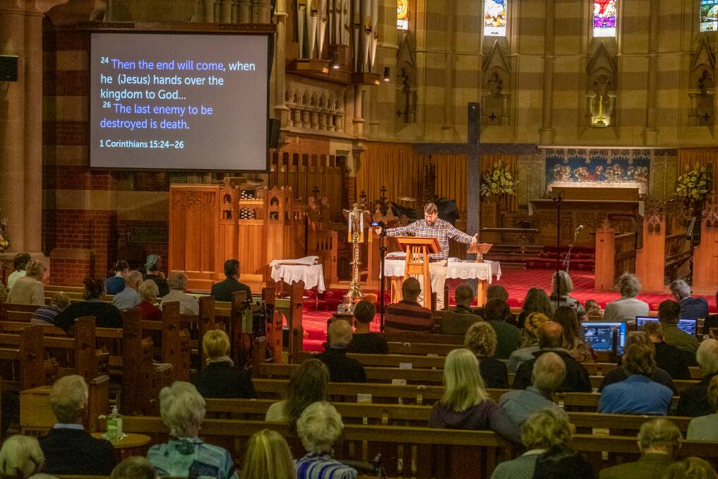 EASTER SERVICE: Reverend James Hornby leads an Easter Sunday service at St Johns Anglican Church in Launceston. Picture: Paul Scambler