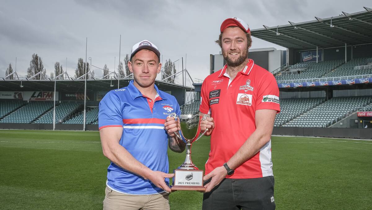 READY TO PLAY: South Launceston's vice captain Jordan Tepper with Bracknell's co-captain Will Fisher with the NTFA premier division trophy. Picture: Craig George 