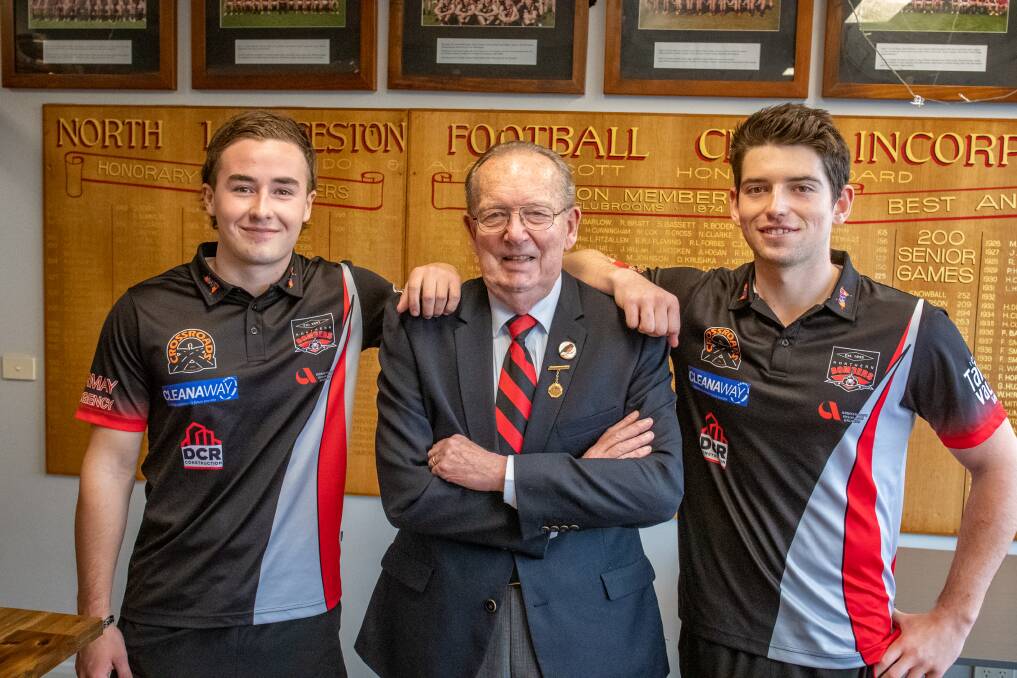 CLUB LEGEND: Current Northern Bombers star Oliver Saunders and club vice-captain Ben Simpson with club patron Frank Madill ahead of his celebratory luncheon this weekend to mark five decades of service to the club. Pictures: Paul Scambler