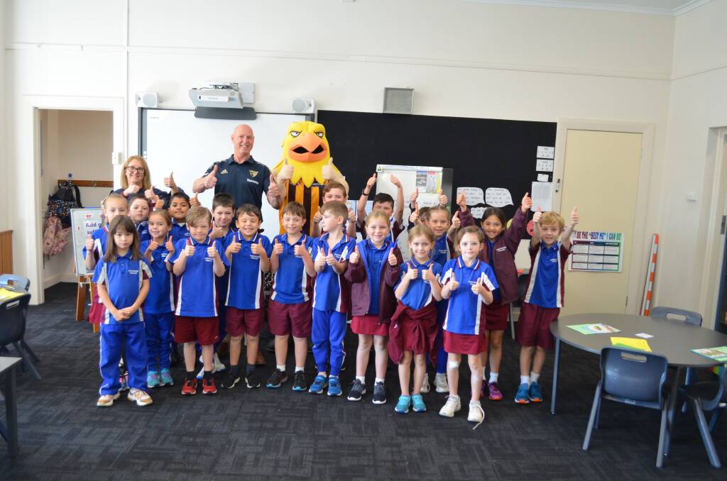 THUMBS UP: Hawthorn Tasmania state manager David Cox and Hawka the Hawk paid a special visit to Punchbowl Primary School's year 2 class. Picture: Adam Daunt 