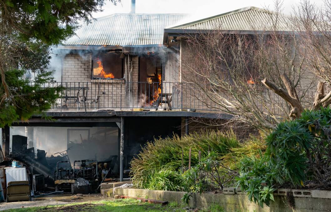 DAMAGED: The TFS have estimated the damage at a Denison Grove property to be more than $500,000 after it was subject to a house fire. Picture: Craig George