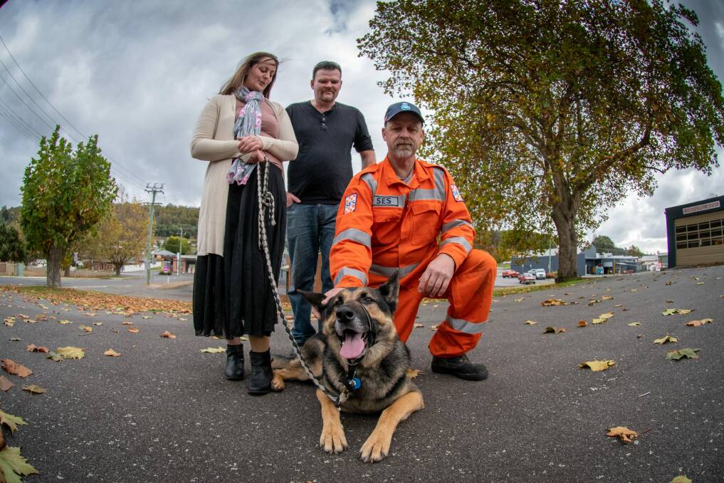 REUNITED: Bear reunited with owners Emma and Dan Rule as well as SES member Tony Britton, who helped Bear from the mineshaft. Picture: Paul Scambler