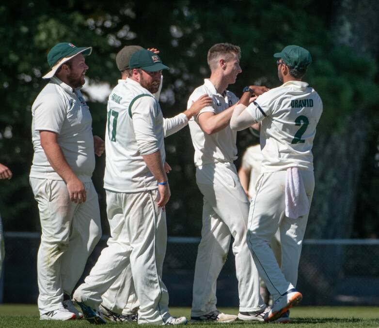 Launceston celebrate a wicket on the first day's play of the grand final.