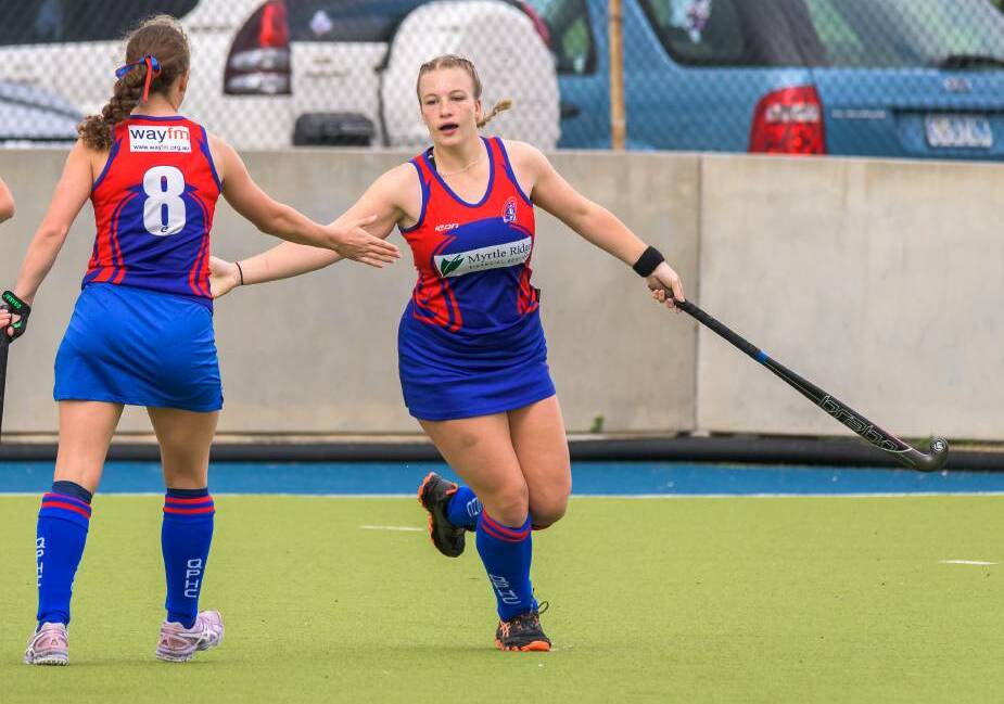STARS: Queechy Penguins rising star Isabella McRobbie celebrates a goal with teammate Lucy Cooper during the season. Picture: Simon Sturzaker