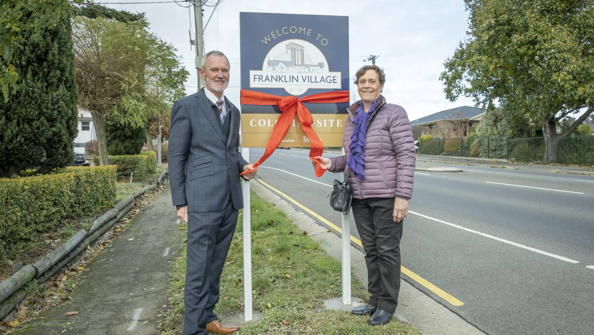 PROUD: Launceston Mayor Albert van Zetten and Julie Dineen with the new signage at Franklin Village. Picture: Craig George 