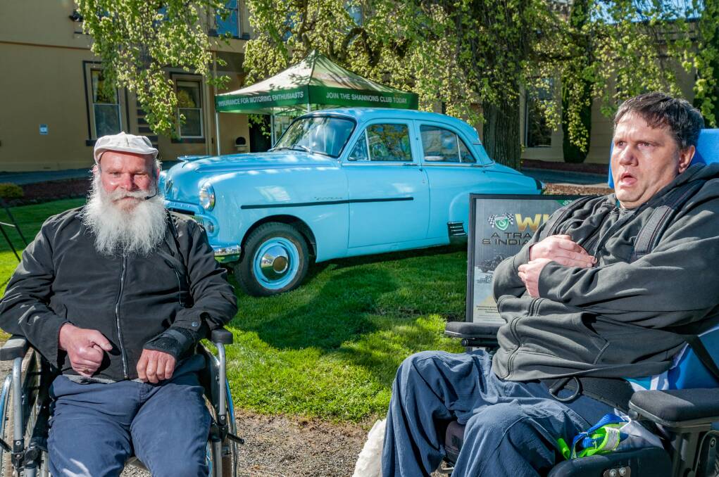 PROUD: Steven Cousens and Peter Wellard with the vintage car they helped restore. Pictures: Phillip Biggs 