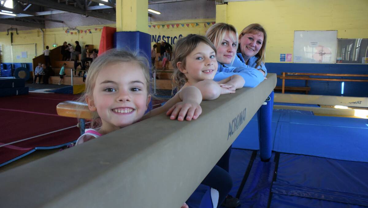 Lacee and Lilah Stewart with KinderGym coaches Tineca Lowe and Pip Headley. Picture: File